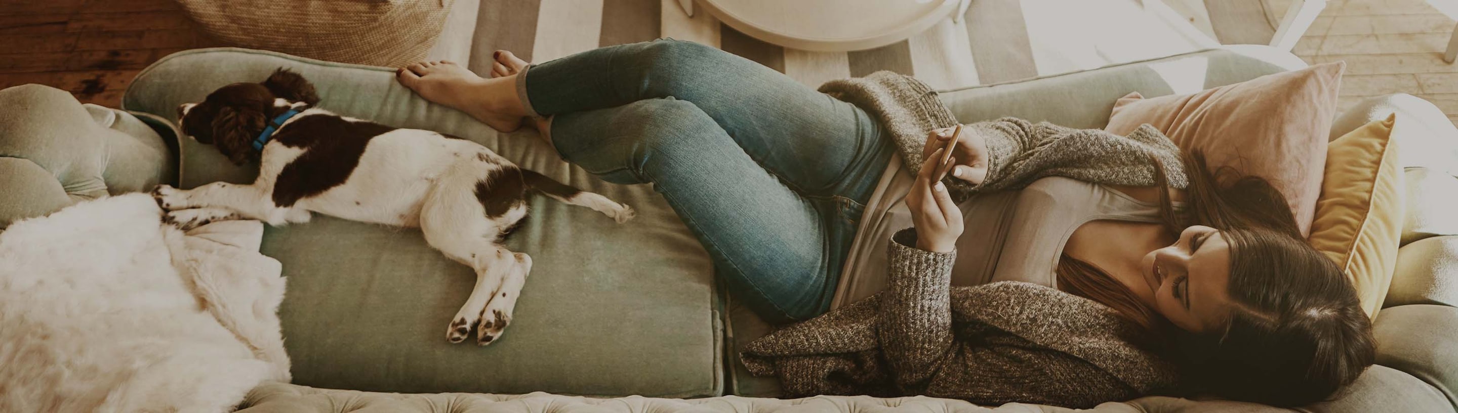 woman-sofa-dog-cellphone-marquee